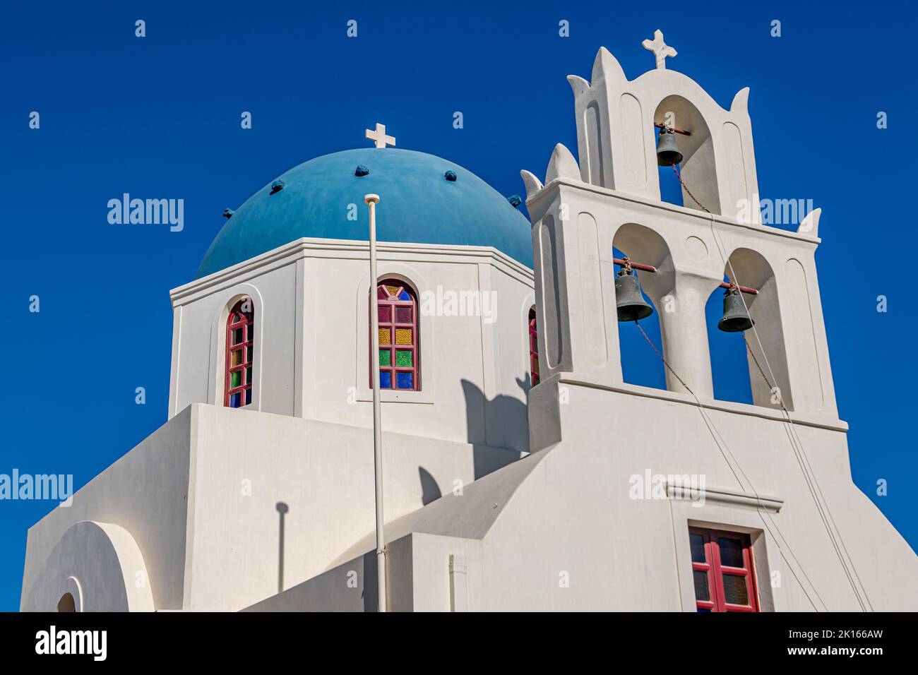 Santorini blue dome churches / coulorful church and white houses with color Stock Photo