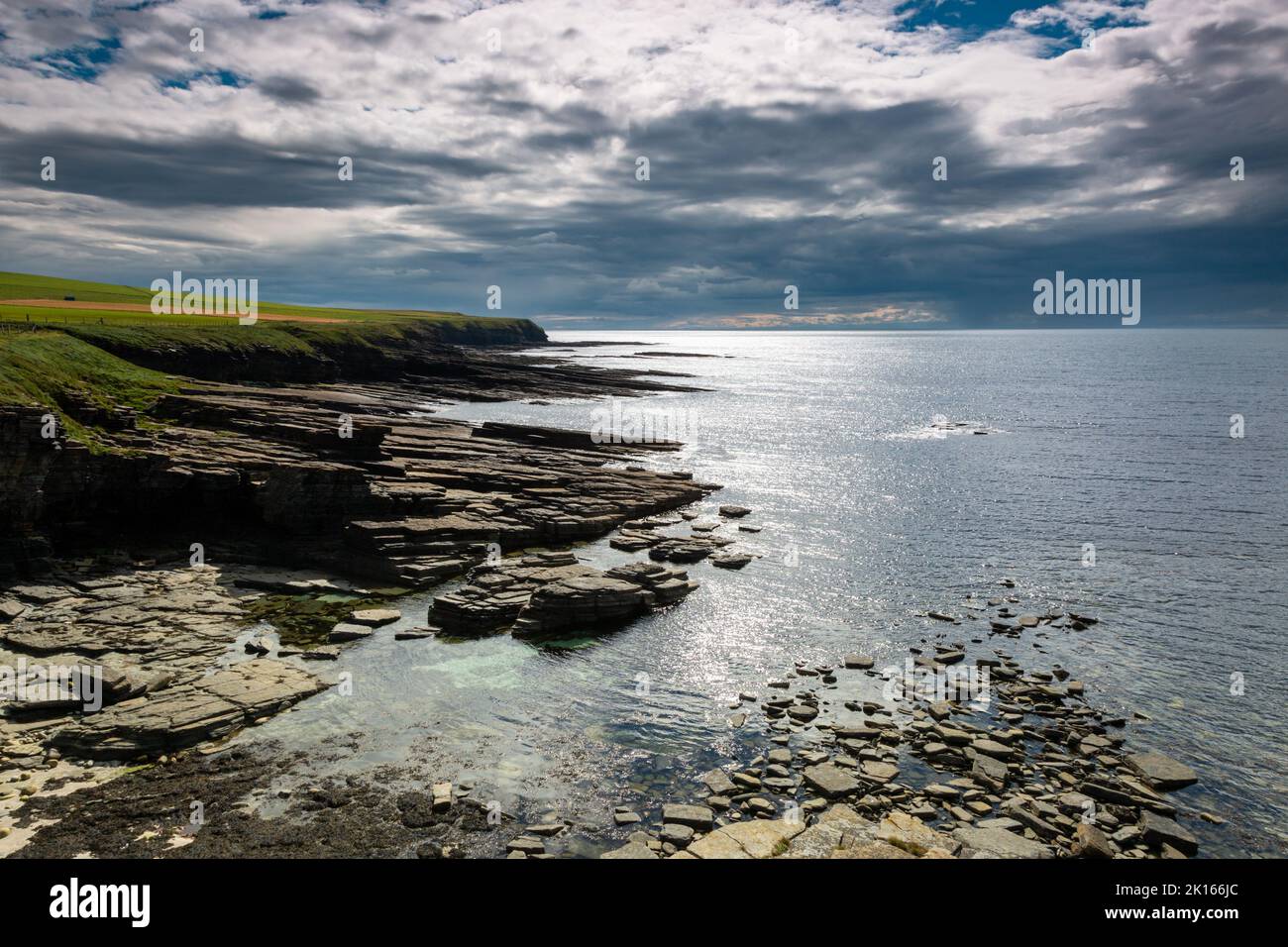 Rock cliffs at Marwick, Orkney mainland, showing strata Stock Photo