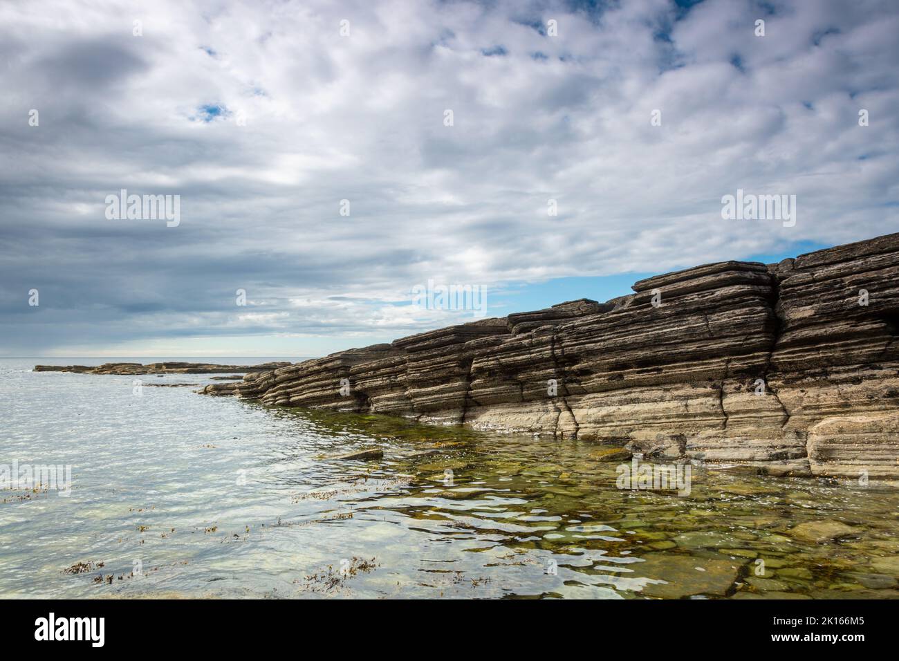 Rock cliffs at Marwick, Orkney mainland, showing strata Stock Photo