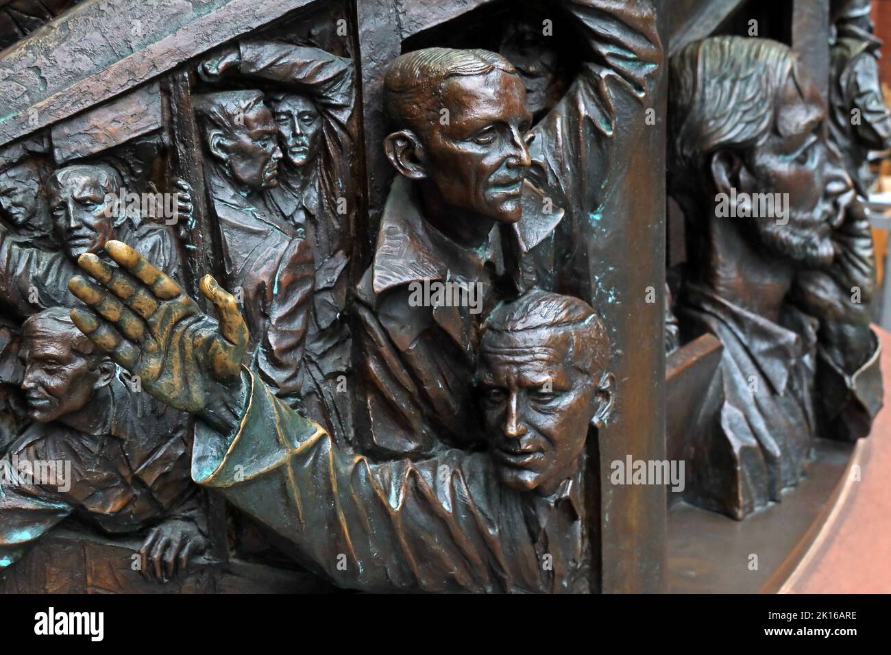 Man waves at the Meeting Place, a statue by British artist Paul Day, in the Grand Terrace, St Pancras International railway station, London N1C 4QP Stock Photo