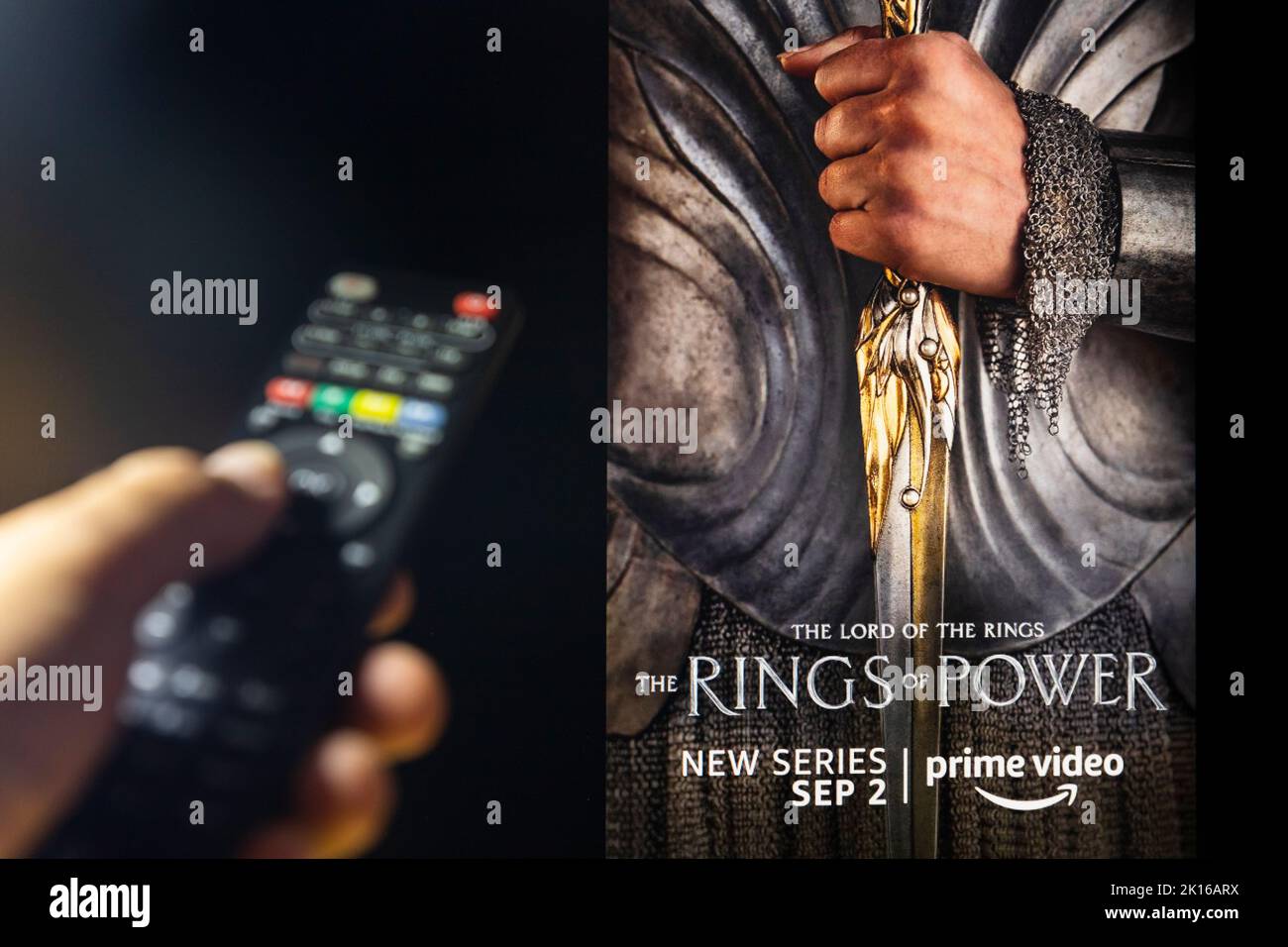 Belgrade, Serbia - September 12, 2022: The Lord of the Rings: The Rings of Power TV series on TV with remote control in hand. Story takes place thousa Stock Photo