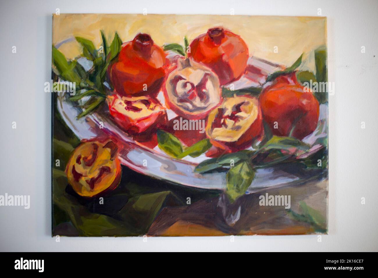 Original Artwork of a Still Life of  Pomegranates on a Silver Tray by Artist Elizabeth Greene Stock Photo