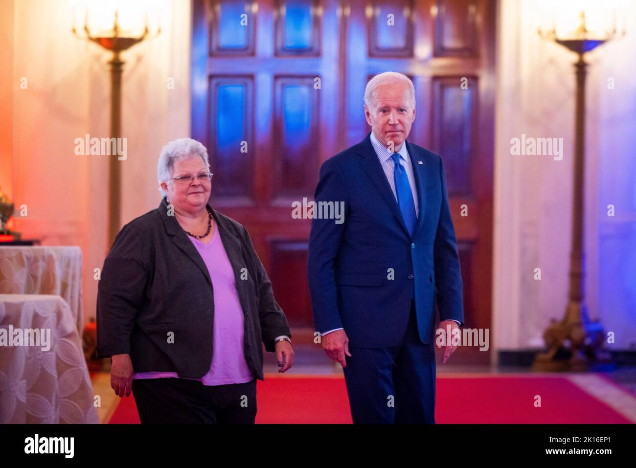 Washington DC, USA. 15th Sep, 2022. United States President Joe Biden (R) along with Susan Bro (L) prepares to speak at the United We Stand Summit in the East Room of the White House in Washington DC, USA, 15 September 2022. Bro is the mother of Heather Heyer, who was killed at the Unite the Right rally in Charlottesville, Virginia in 2017. Credit: Jim LoScalzo/Pool via CNP/dpa/Alamy Live News Stock Photo