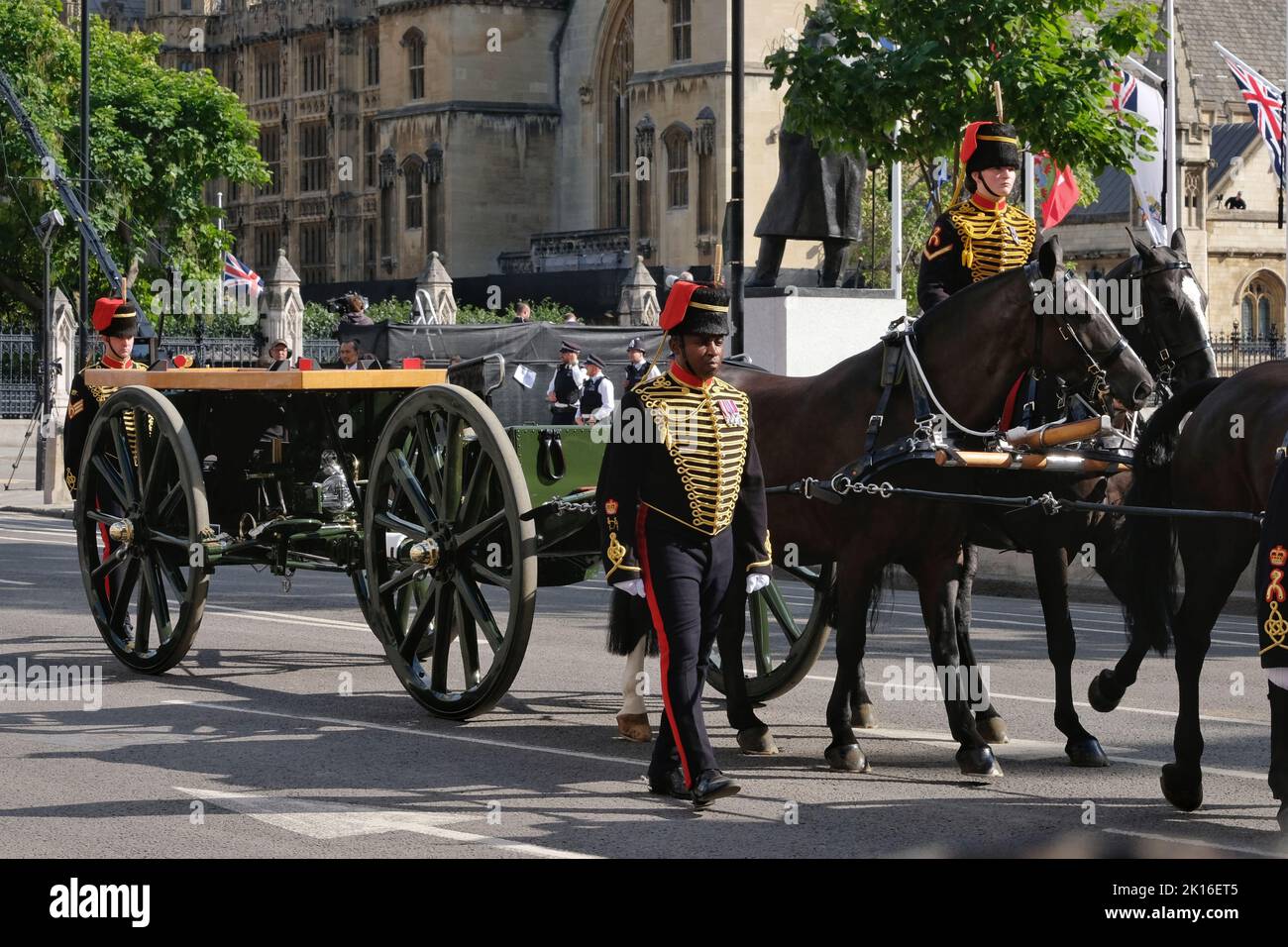 An empty gun carriage proceeds along Parliament Square after the Queen