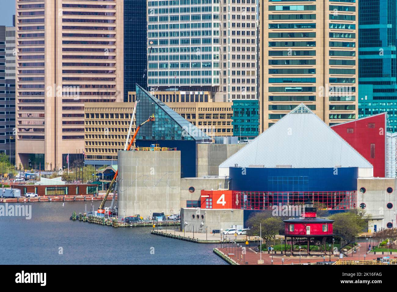 Baltimore Inner Harbor, Baltimore Maryland, with National Aquarium, Seven Foot Knoll Lighthouse, and mixed historic and modern skyscrapers. Stock Photo