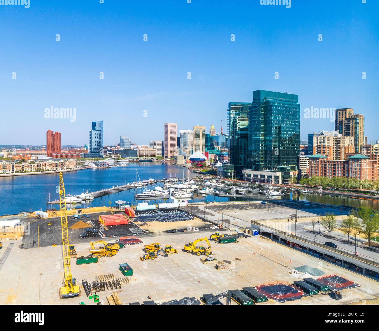 T Rowe Price Global Headquarters Site under construction in Baltimore Inner Harbor with view of harbor skyscrapers, Baltimore, Maryland. Stock Photo