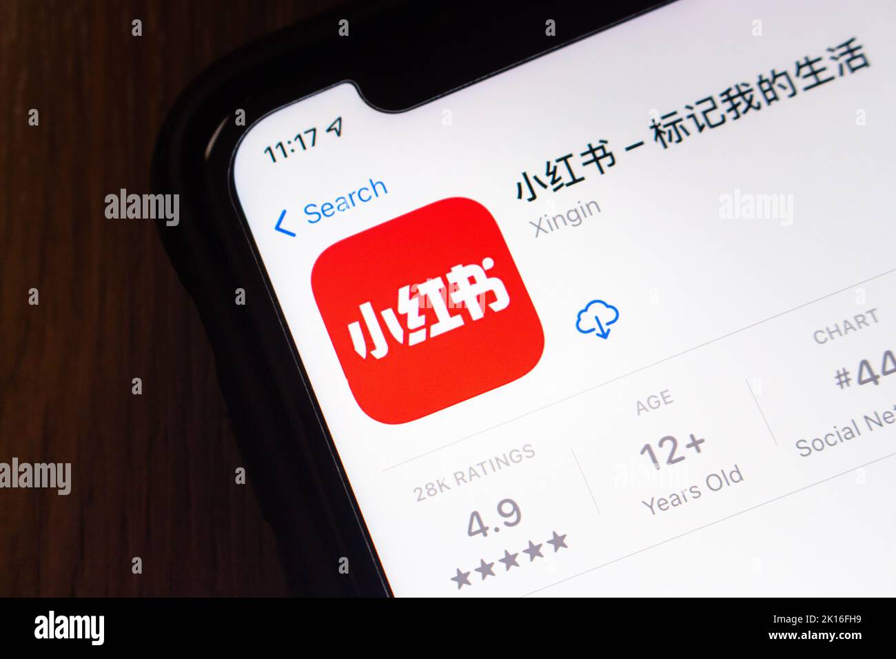 Chinese social media and e-commerce platform Xiaohongshu (Xingin app, also known as Little Red Book, or simply Redbook) in App Store on iPhone. Stock Photo