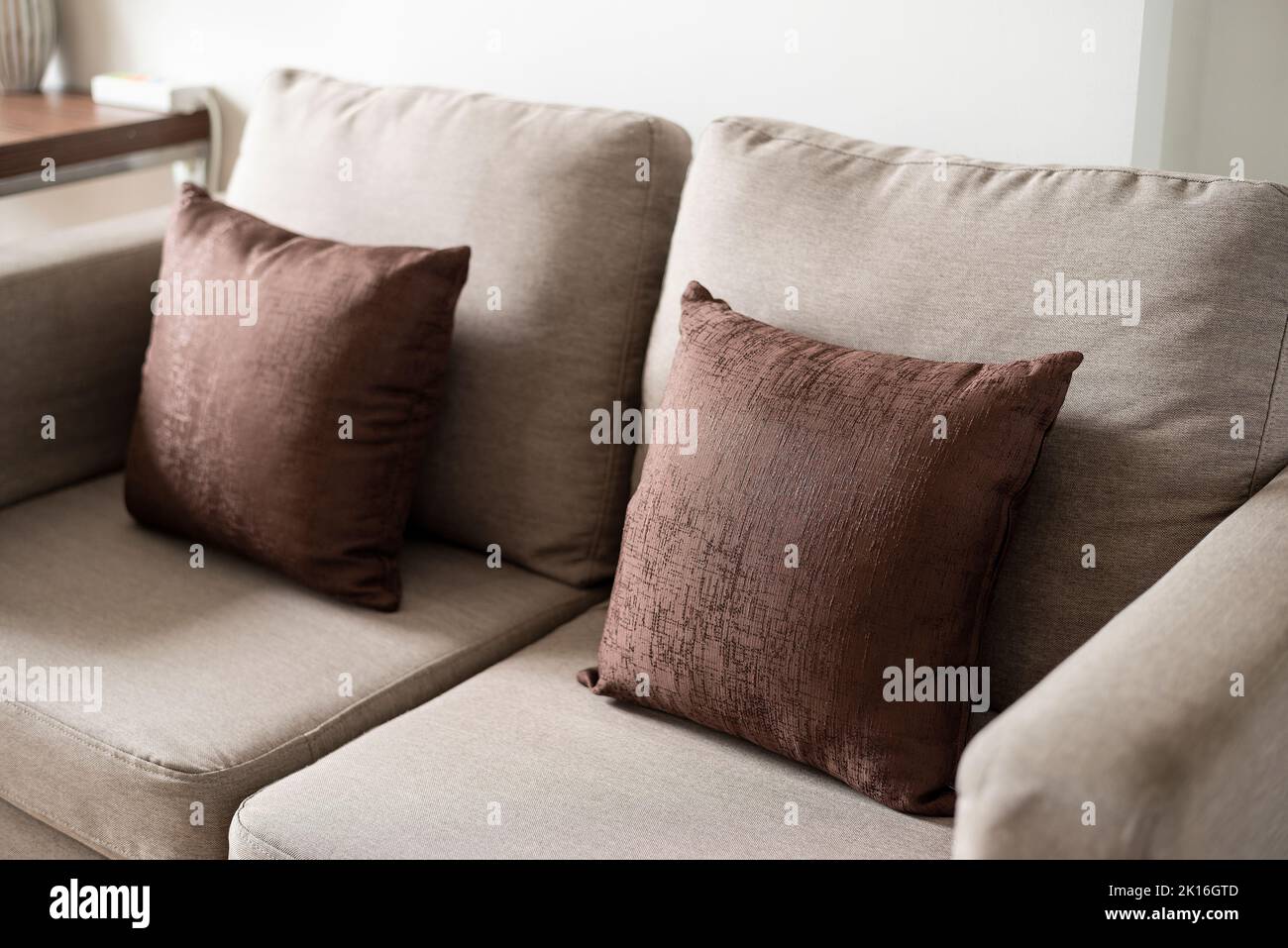 Close up brown sofa pillow in living room decoration Stock Photo