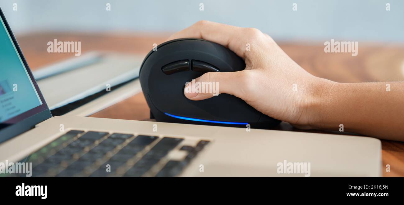 woman hand using computer ergonomic mouse, prevention wrist pain because working long time. De Quervain s tenosynovitis, Intersection Symptom, Carpal Stock Photo