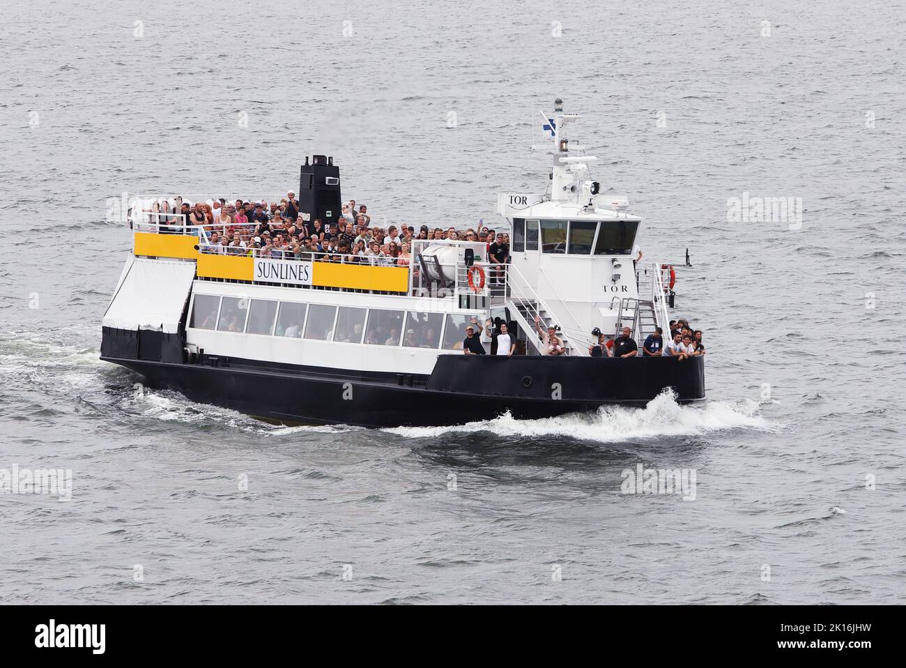 Helsinki, Finland - August 20, 2022: Sunblines tour boat with happy passengers in the port of Helsinki. Stock Photo