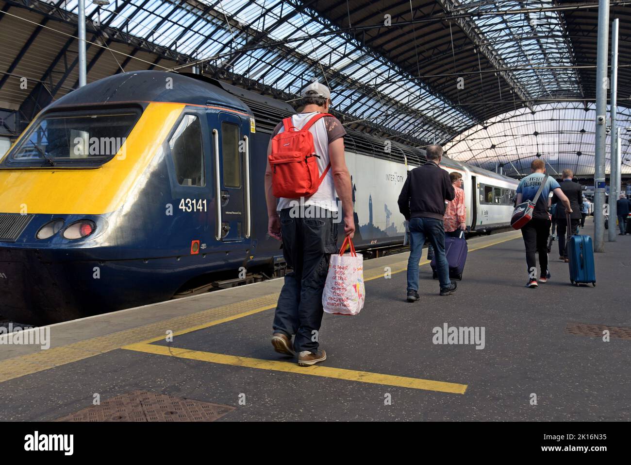 Passengers getting on a Scotrail Inter 7 City HST train at Queen Street