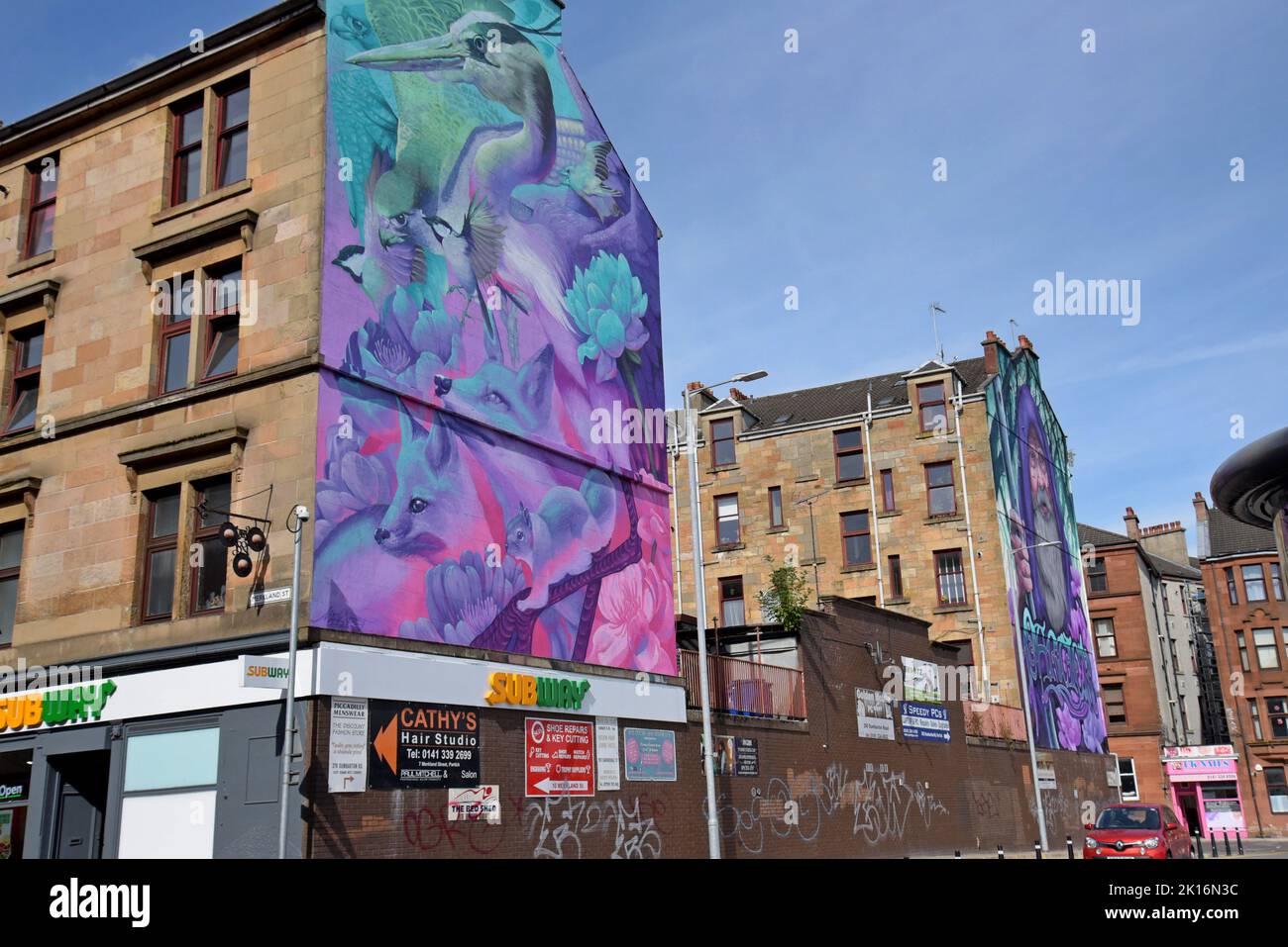 Gable end Murals depicting wildlife, Merlin and Lobey Dosser, part of the Yardworks GRID Project in Merkland Court, Partick, Glasgow, UK Stock Photo