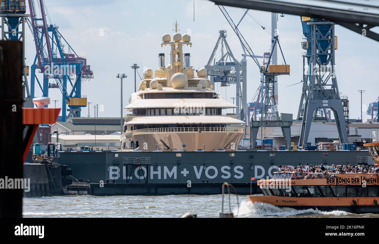 Hamburg, Germany. 23rd Aug, 2022. The mega-yacht 'Dilbar' is moored at Blohm Voss Dock Elbe 17 in the Port of Hamburg. The ship, which is around 156 meters long, is said to belong to a Russian oligarch. Credit: Markus Scholz/dpa/picture alliance/dpa | Markus Scholz/dpa/Alamy Live News Stock Photo