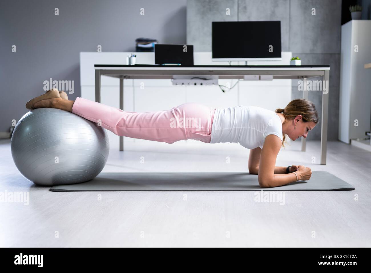 Exercise Workout With Fitness Ball At Office Desk Stock Photo Alamy