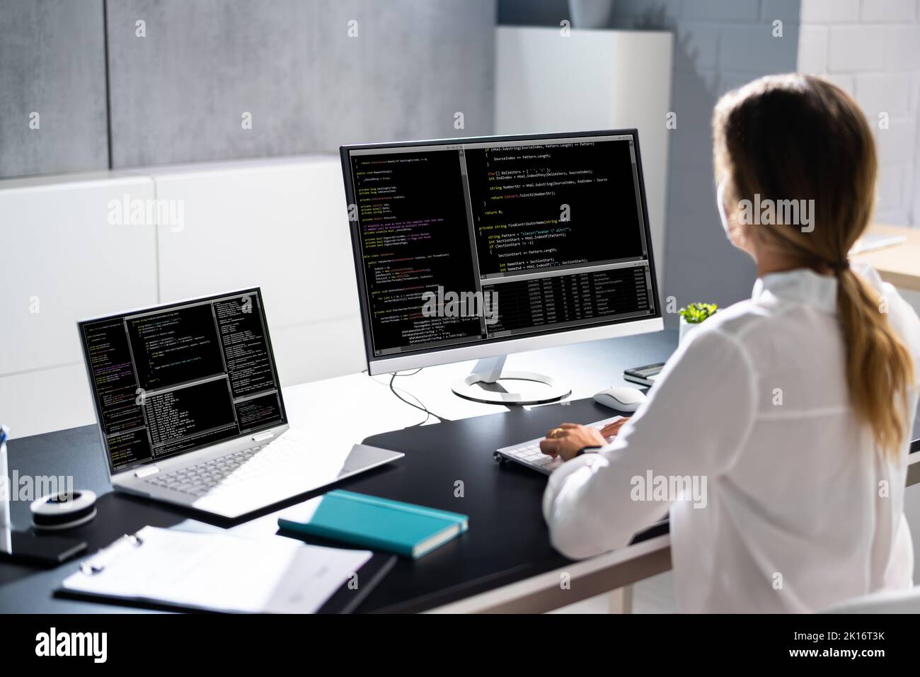 Woman programmer girl coding software on computer stock photo alamy