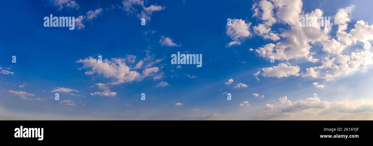Scenic view of blue sky with fluffy clouds. Panorama Stock Photo - Alamy