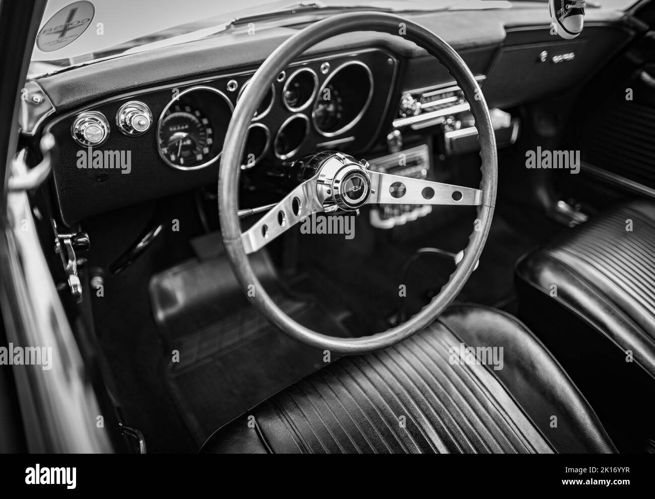 Close up on old vintage car steering wheel and cockpit. Retro styled image of an old car radio inside classic car Chevrolet-September 9, 2022-Vancouve Stock Photo