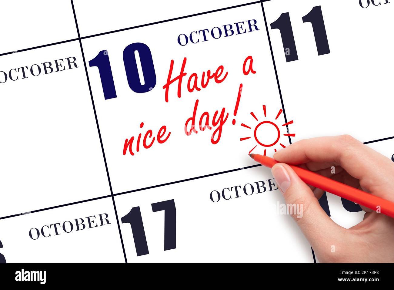 10th day of October. The hand writing the text Have a nice day and drawing the sun on the