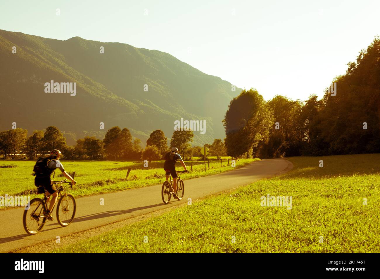 Two person riding bikes in a mountain valley Stock Photo