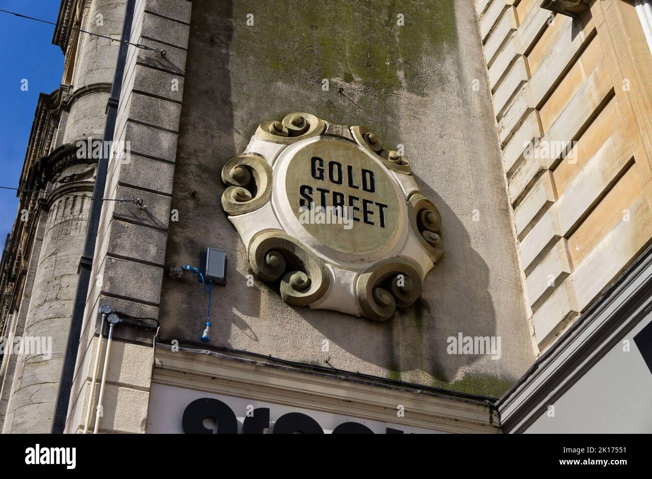 Ornate wall mounted sign for Gold Street, in the town centre, Northampton, UK Stock Photo