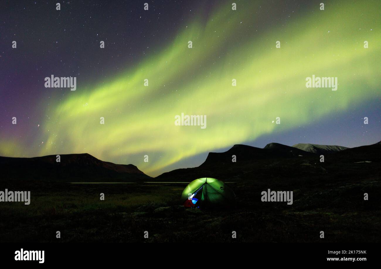 Northern Lights, also called Aurora Borealis, are seen in the night sky over a camping tent, during autumn in Lapland, near Abisko, Sweden September 8, 2022. REUTERS/Lisi Niesner     TPX IMAGES OF THE DAY Stock Photo