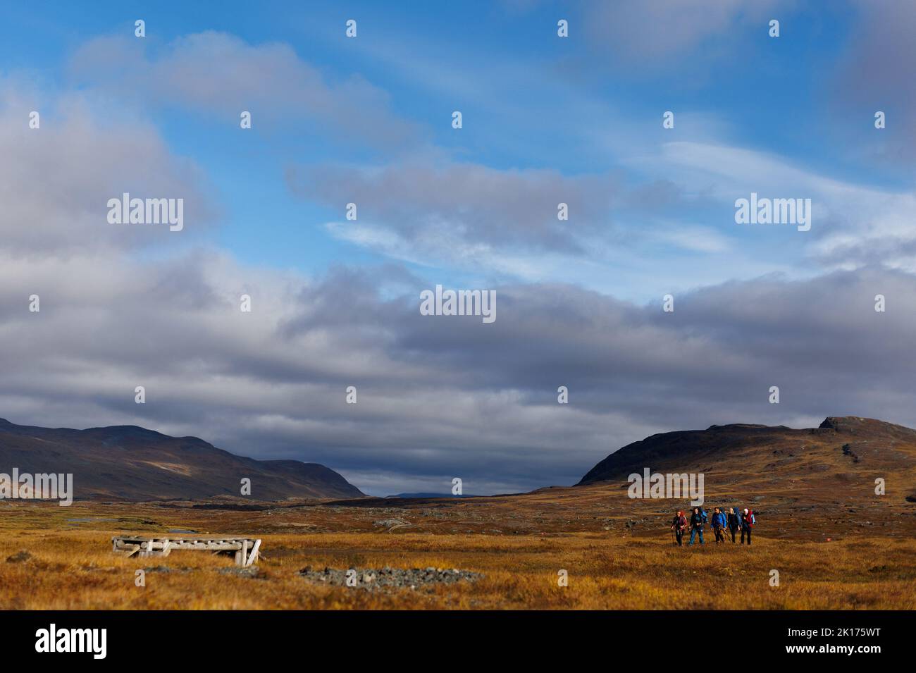 A group of hikers make their way along King's Trail (Kungsleden) route, during autumn in Lapland, near Abisko, Sweden September 10, 2022. REUTERS/Lisi Niesner Stock Photo