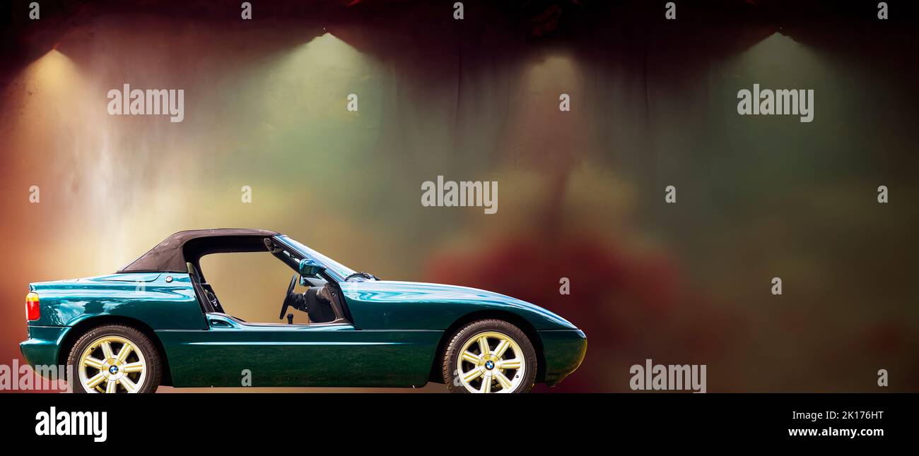 BMW Z1 sports car with top closed and doors removed against a blurred dark pastel background, vehicle location Lehnin, Germany, September 11, 2022. Stock Photo