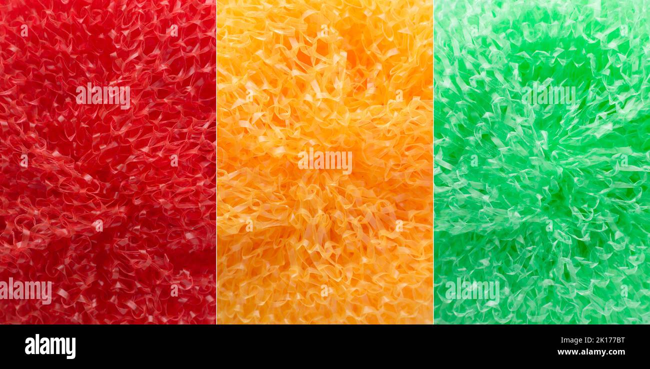 abstract background of colorful plastic scrubbers or kitchen dish washers, red, yellow and green texture, collection Stock Photo
