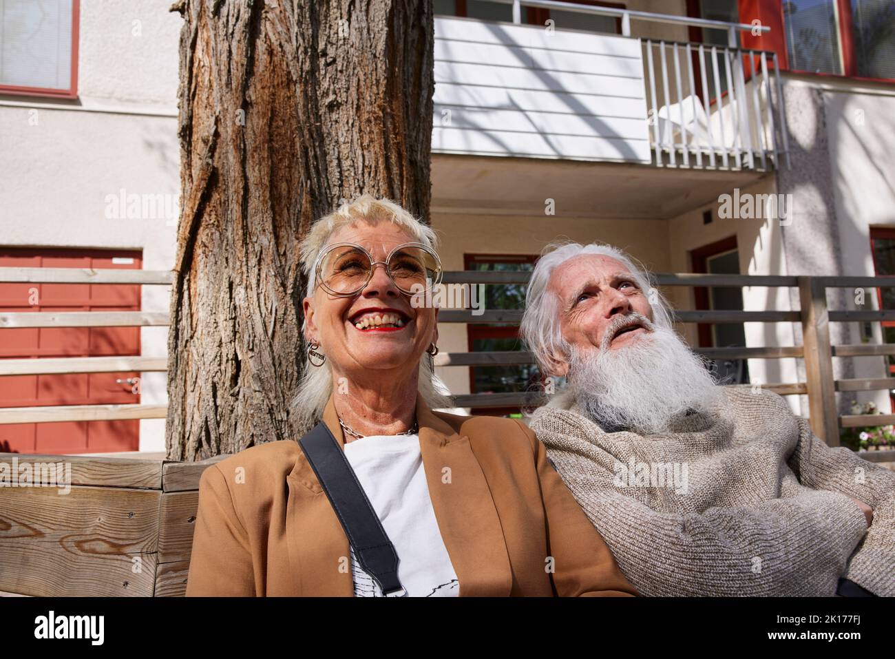Smiling couple sitting together Stock Photo