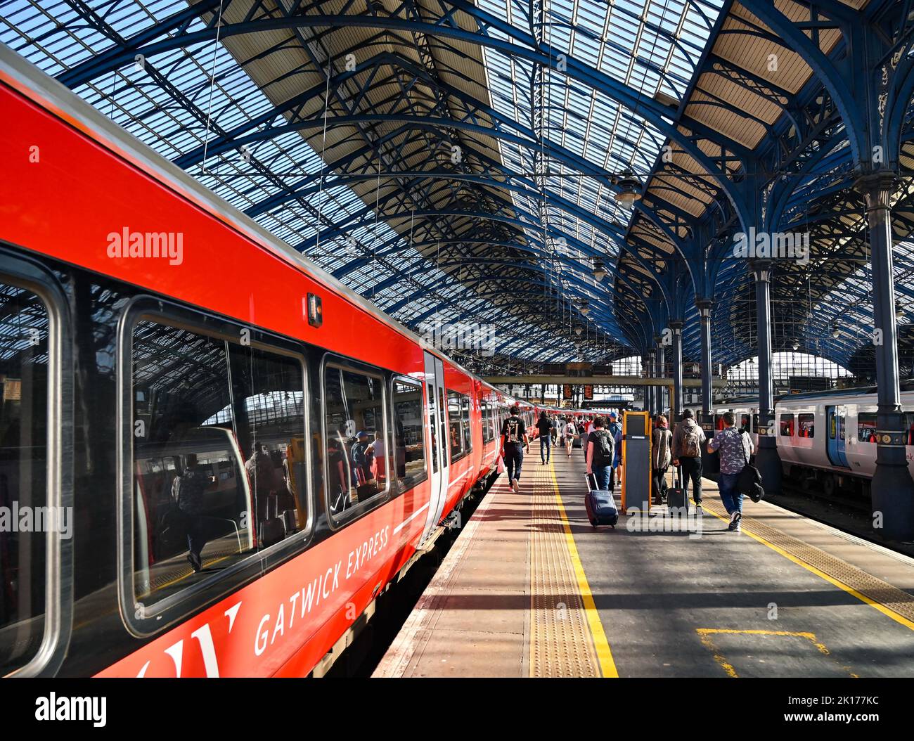 Gatwick Express train on the platform at Brighton Railway Station in Sussex UK  Photograph taken by Simon Dack Stock Photo