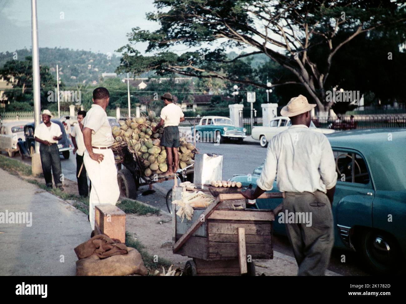 Street traders on pavement opposite Queen's Park Savannah, Port of Spain, Trinidad, 1963 Stock Photo