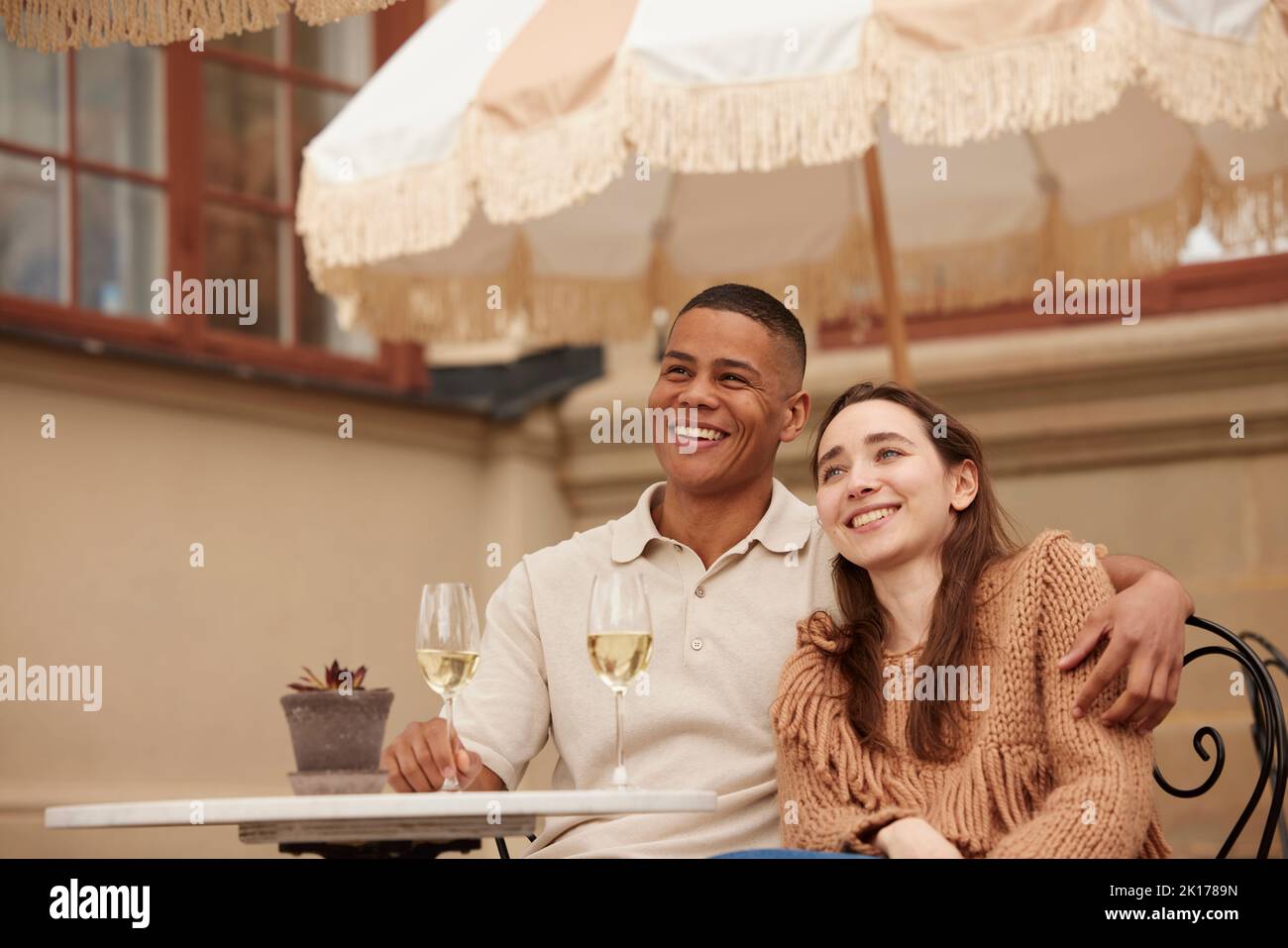 Couple celebrating on patio Stock Photo