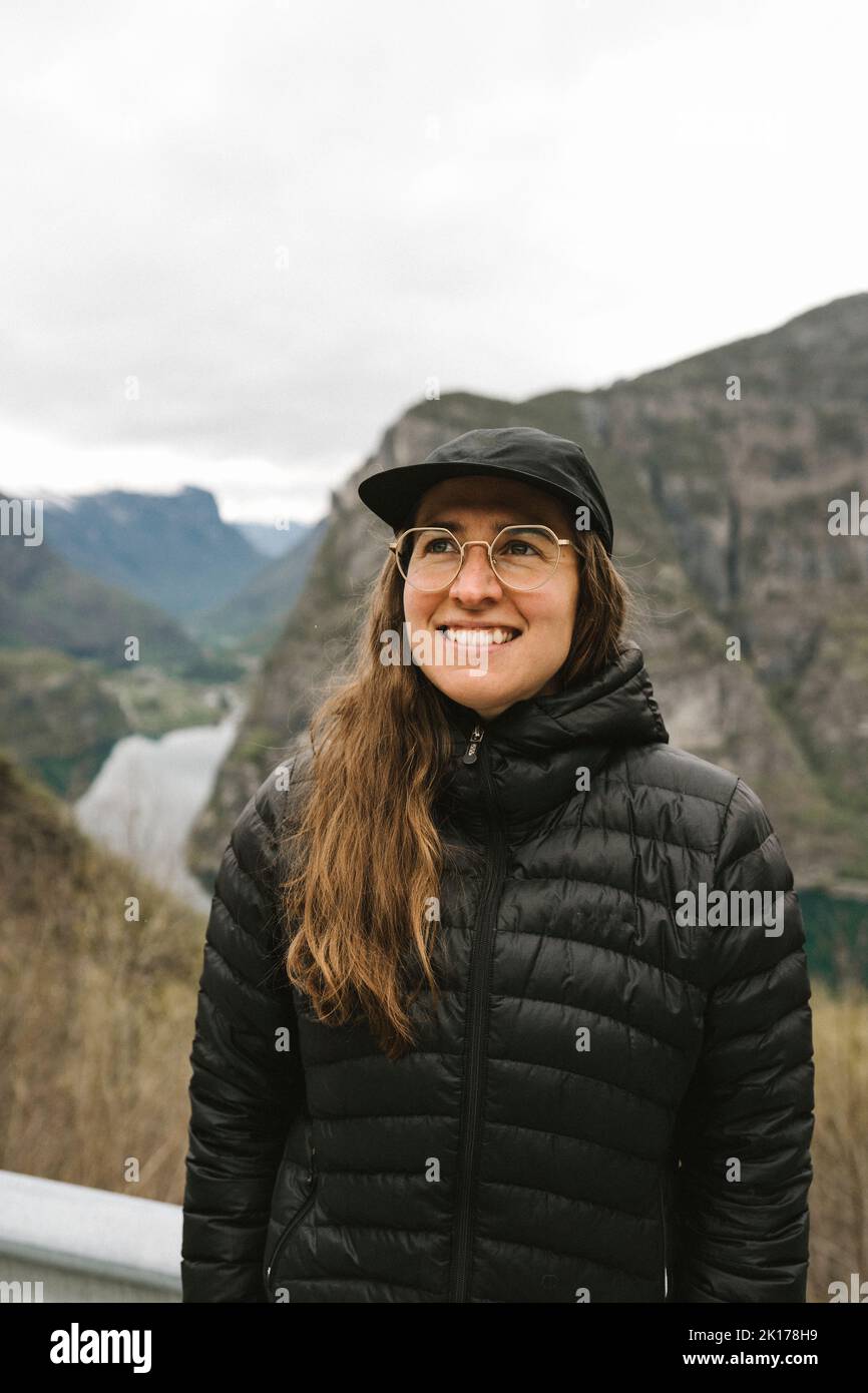 Woman travelling by ferry in fiord Stock Photo