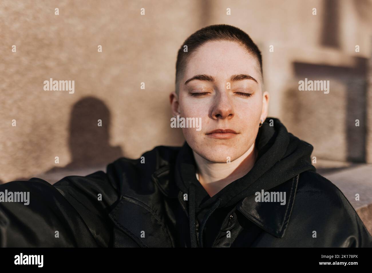 Young woman with eyes closed Stock Photo