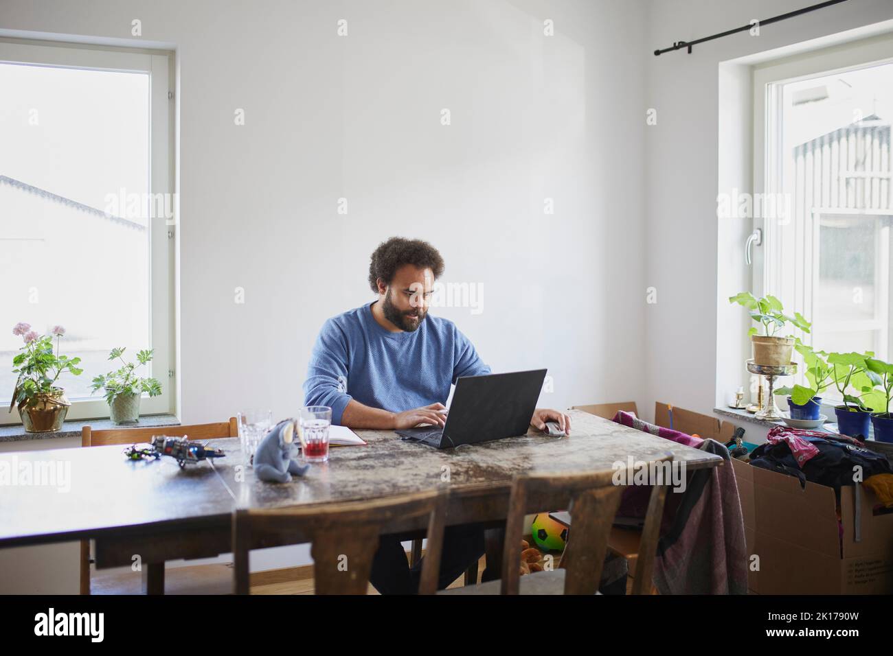 Man working on laptop from home Stock Photo