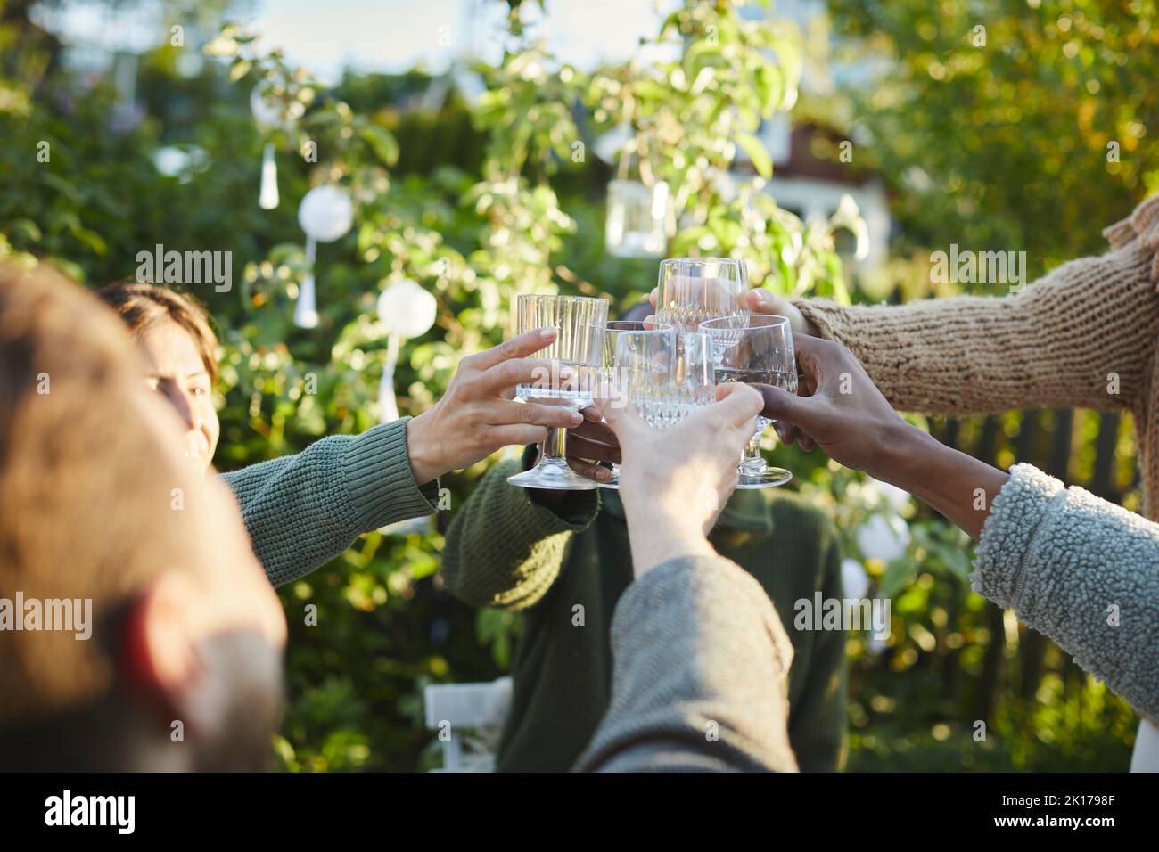 Hands with wineglasses toasting Stock Photo