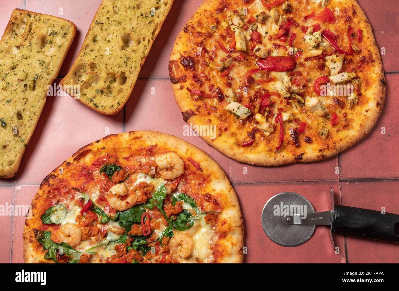 Pizzas and garlic ciabatta Stock Photo
