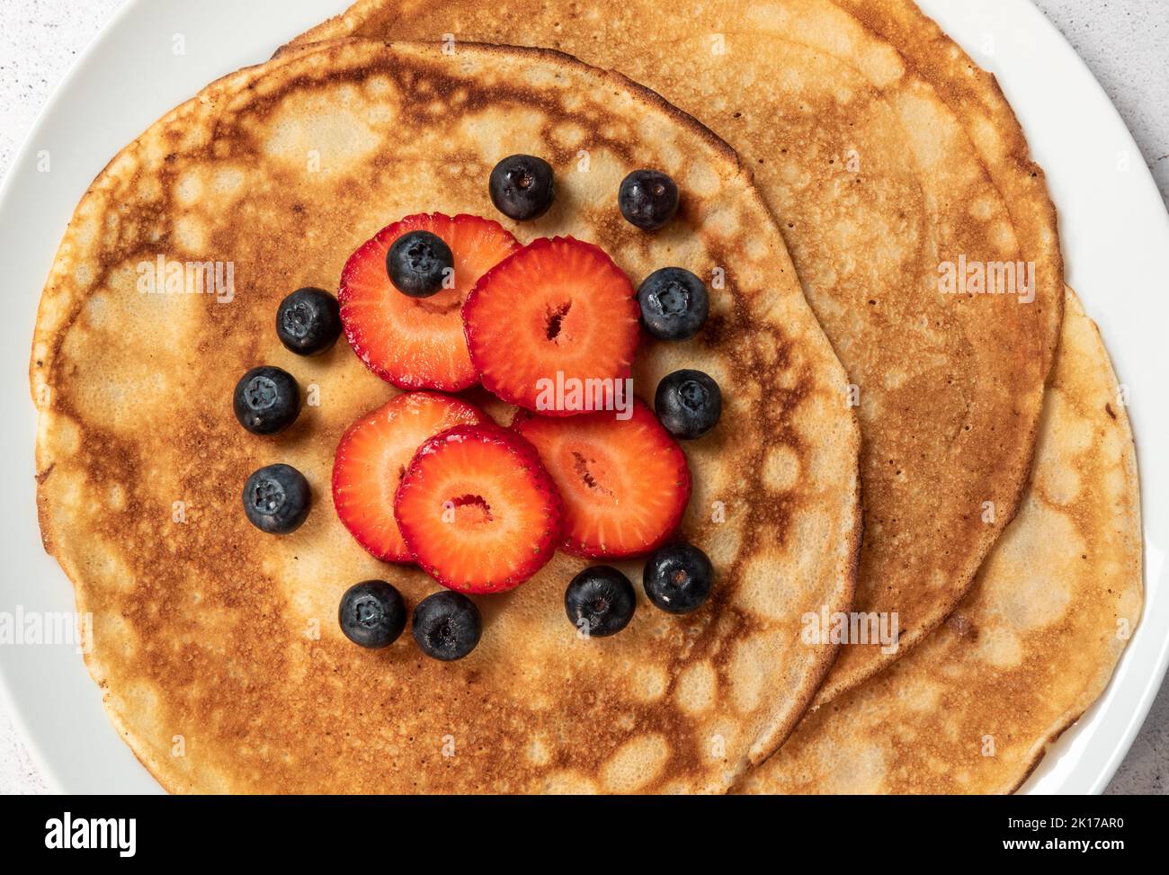 Pancakes with strawberries and blueberries Stock Photo