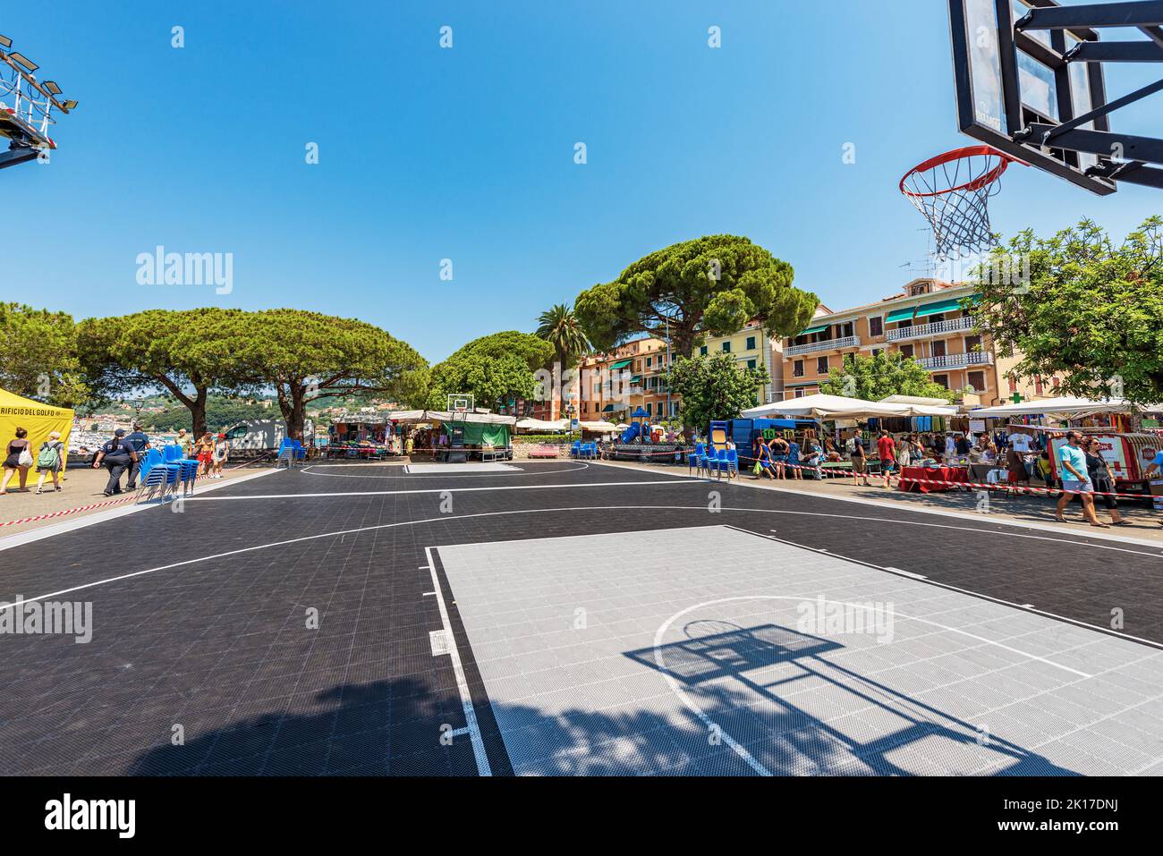 Outdoor basketball court and street market in Lerici downtown. Tourist