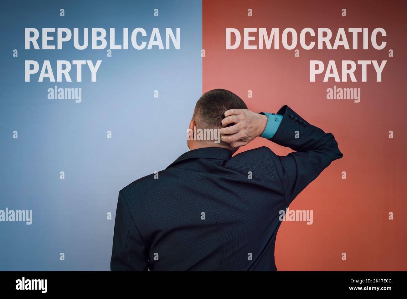 Democrats vs republicans. the concept of choosing a political party or ideology. A male voter to make a choice . Stock Photo