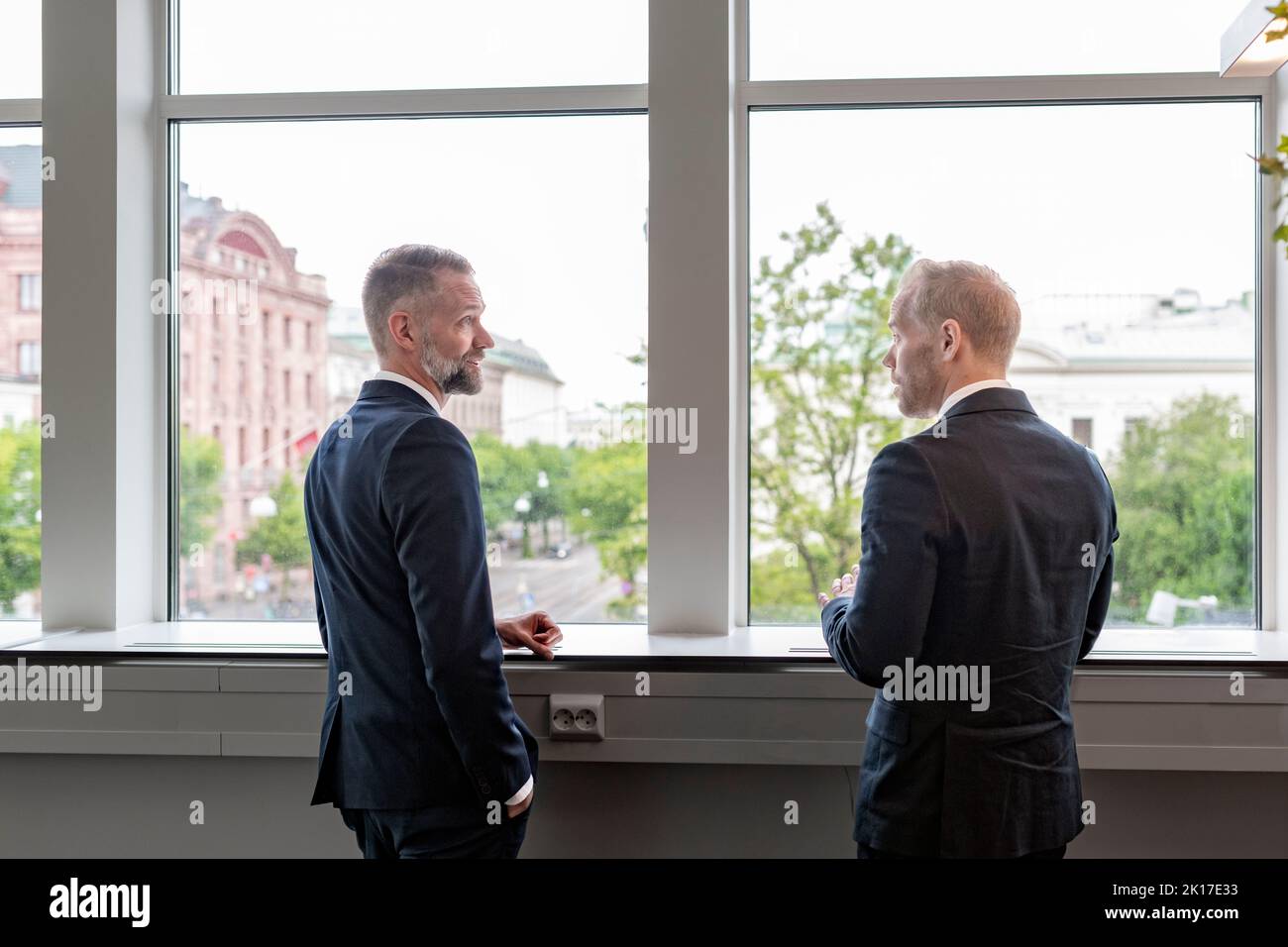 Businessmen talking during break Stock Photo