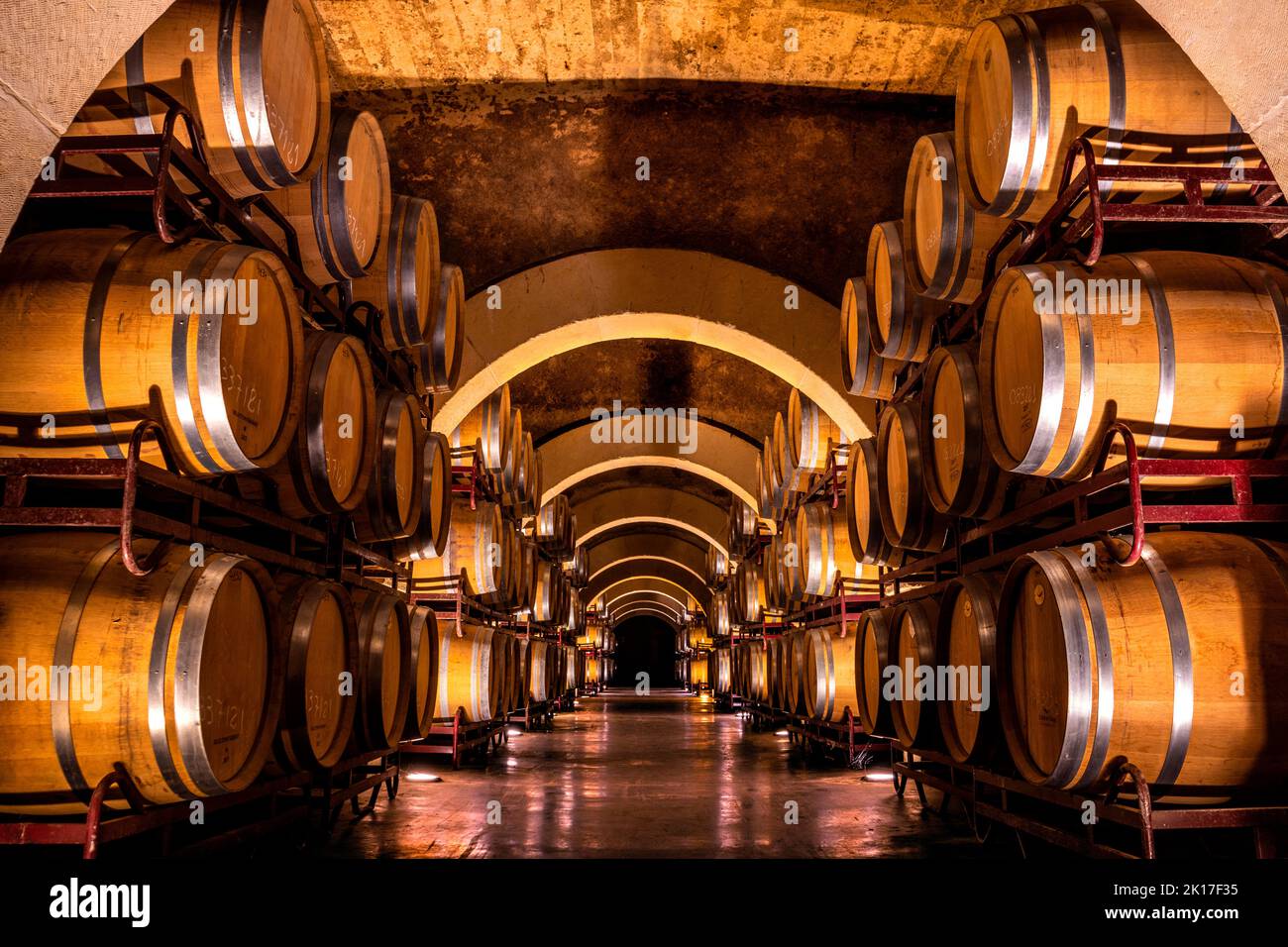 Cellar of a wine cellar with macerating wine barrels. Stock Photo