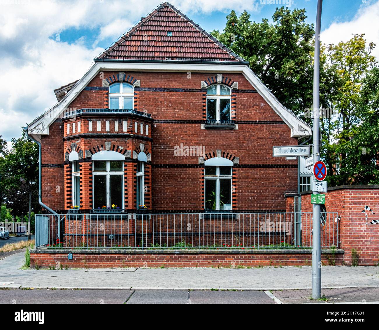 Red clinker brick residential building on Cnr Blaschkoallee & Riesestrasse,, Britz, Neukölln, Berlin, Stock Photo