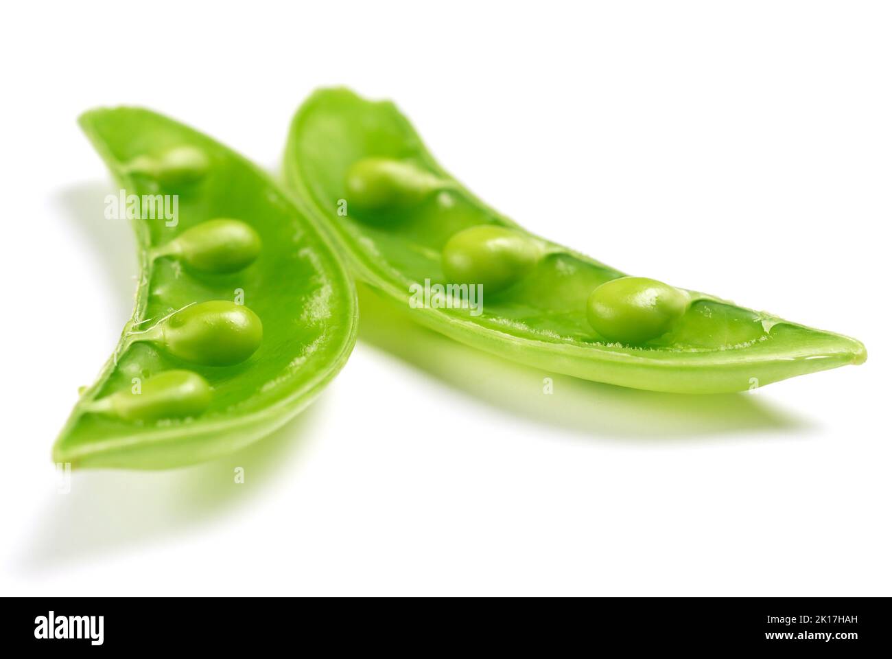 opened sugar snap pea pod on white, product of kenya cut out Stock Photo