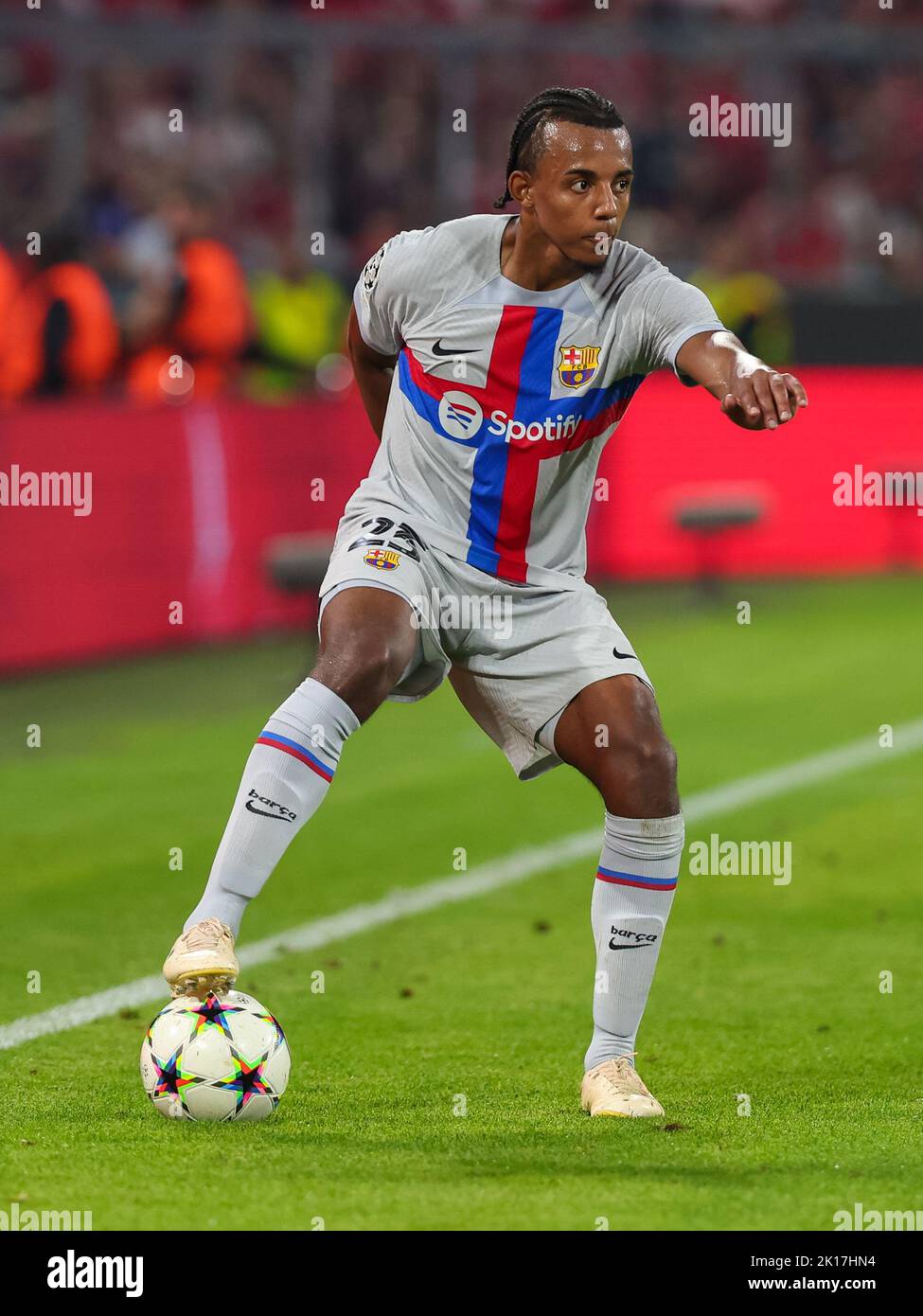 MUNCHEN, GERMANY - SEPTEMBER 13: Jules Kounde of FC Barcelona runs with the ball during the Group C - UEFA Champions League match between FC Bayern Munchen and FC Barcelona at the Allianz Arena on September 13, 2022 in Munchen, Germany (Photo by DAX Images/Orange Pictures) Stock Photo
