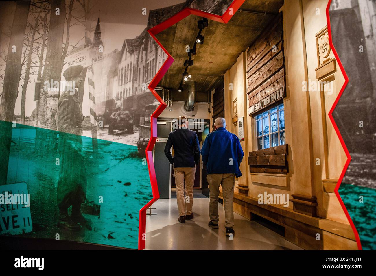 Nijmegen, Netherlands. 15th Sep, 2022. Two men are seen entering the hall where the movie reunion is going to take place. On the occasion of the 78th anniversary of the Market Garden operation in The Netherlands, the Info Center WW2 in Nijmegen offered an analysis of the film 'A Bridge Too Far'. The special night counted with the presence of actor Peter Faber, who played the role of Captain Arie Dirk 'Harry' Bestbreurtje in the movie and talked about his experience during the movie. Other extra actors and one of the production assistants from the movie were there talking about their experience Stock Photo