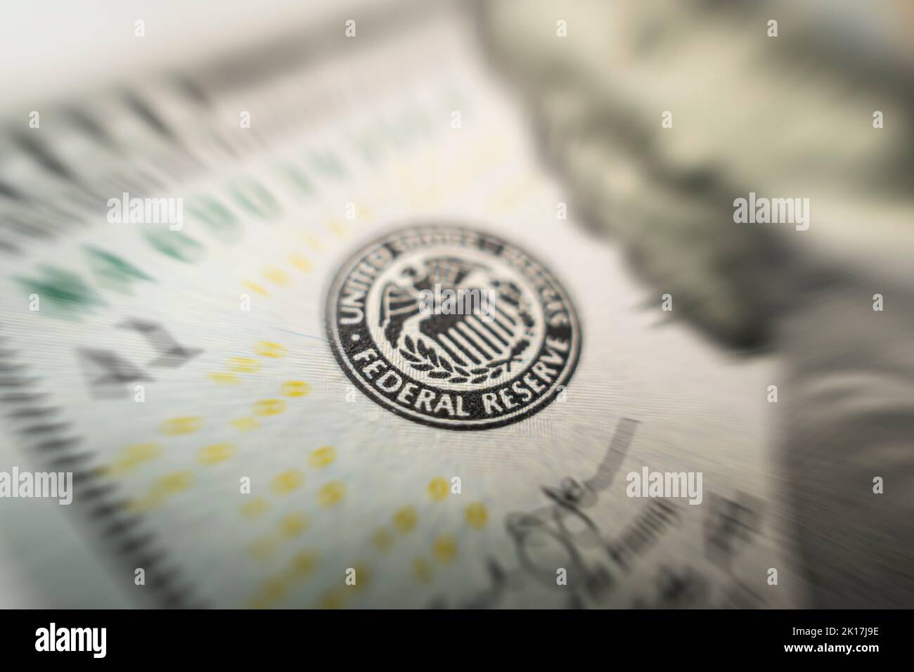 Selective focus on US Federal Reserve emblem on hundred dollars banknote as FED consider interest rate hike, economics, inflation control national org Stock Photo