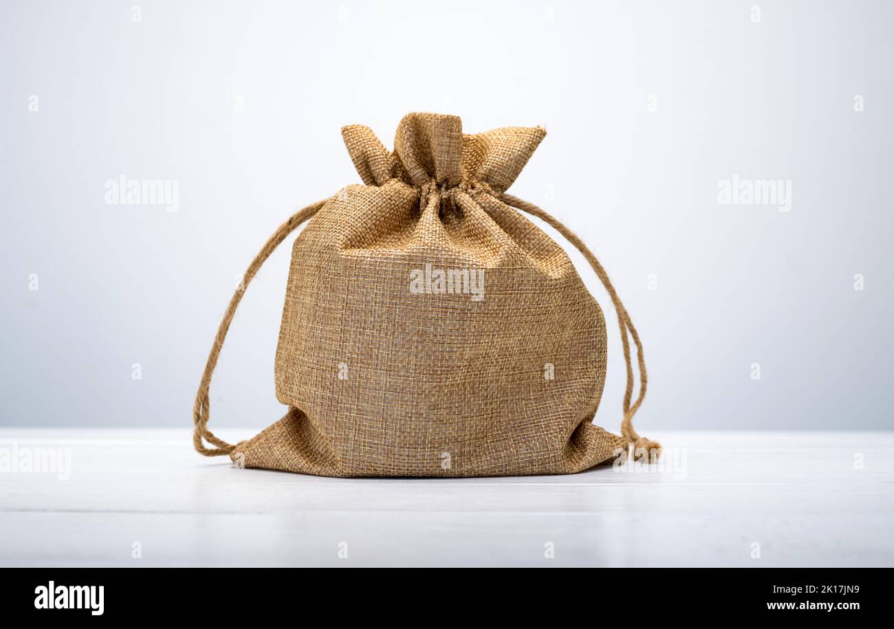 Burlap bag on white table Stock Photo