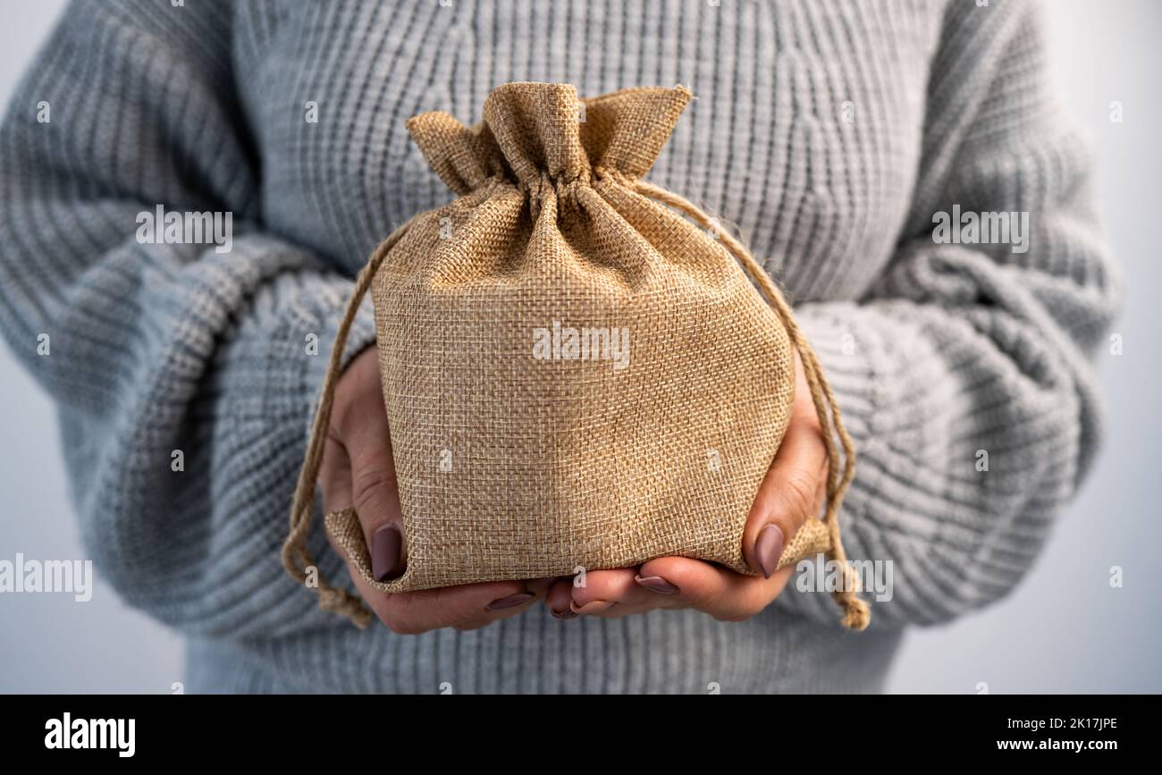 Person holding burlap bag Stock Photo Alamy