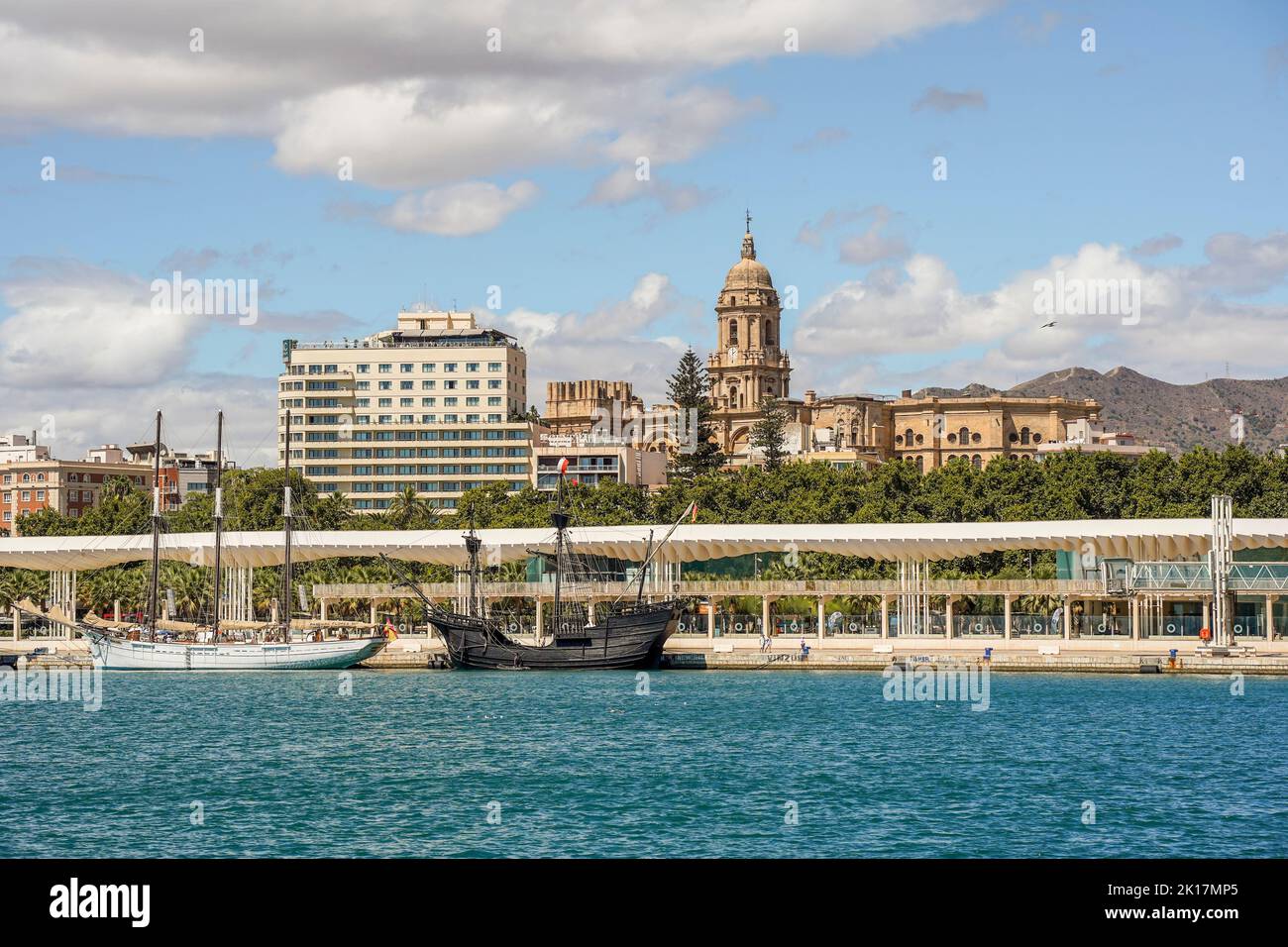Three replicas of old sailing ships, Nao Victoria, Pascual Flores, moored in the port of Malaga, Cathedral behind, Andalucia, Spain. Stock Photo
